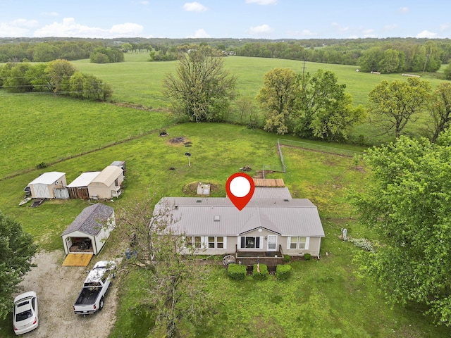 birds eye view of property featuring a rural view