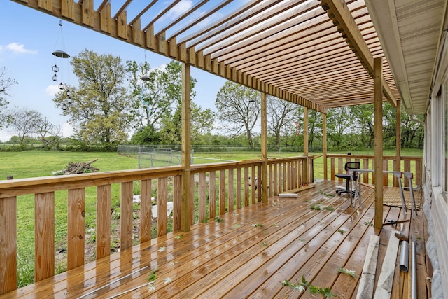 wooden terrace with a lawn, a pergola, and a fenced backyard