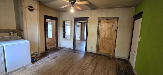 clothes washing area featuring separate washer and dryer, laundry area, a ceiling fan, and wood finished floors