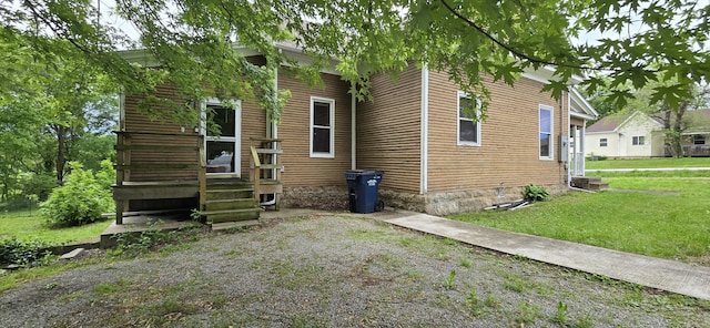 view of property exterior featuring a yard
