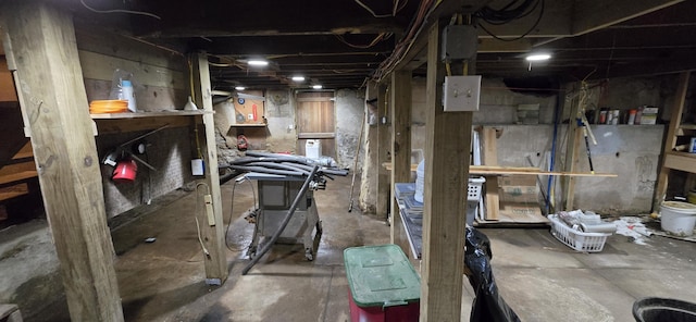 unfinished basement with a workshop area