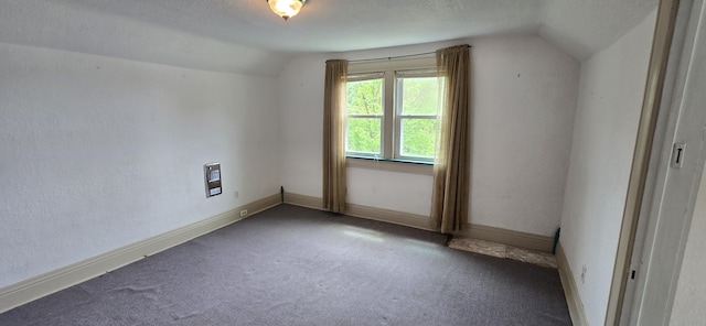 bonus room with baseboards, carpet, and vaulted ceiling