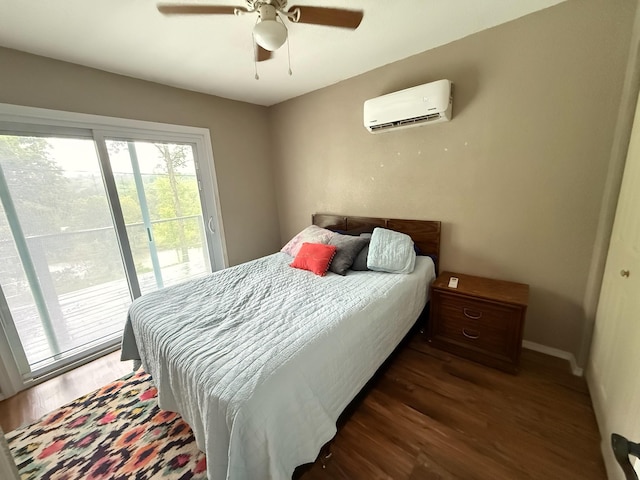bedroom with ceiling fan, access to exterior, baseboards, wood finished floors, and a wall mounted AC