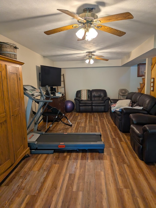 249 Mount Vernon Rd, Forsyth, MO 65653 - workout area with a textured ceiling, ceiling fan, and wood finished floors