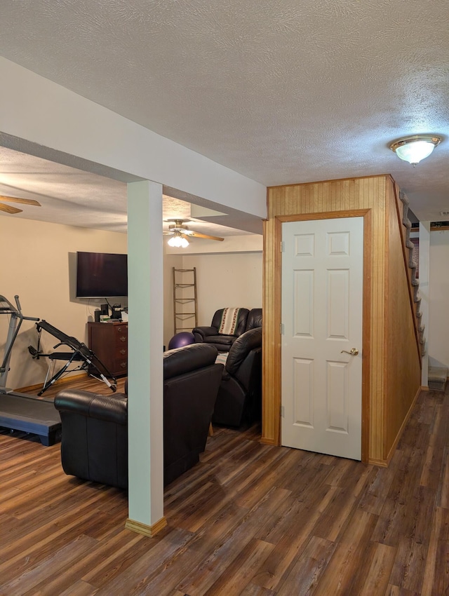 249 Mount Vernon Rd, Forsyth, MO 65653 - living room with stairs, a ceiling fan, a textured ceiling, and dark wood-style floors