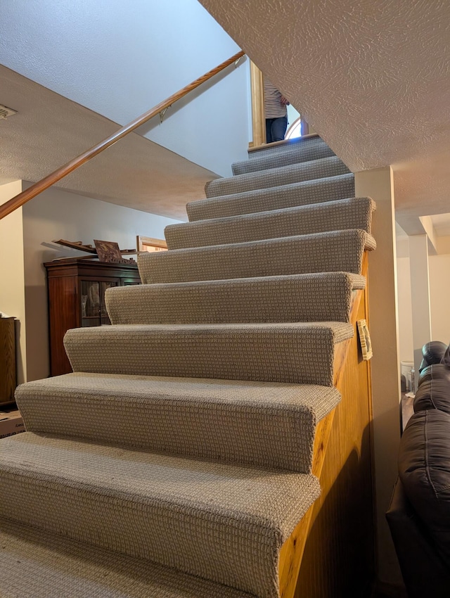 249 Mount Vernon Rd, Forsyth, MO 65653 - stairway featuring a textured ceiling