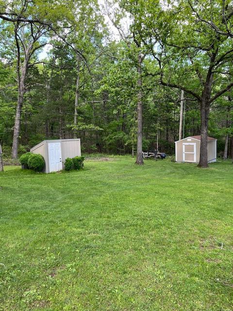 249 Mount Vernon Rd, Forsyth, MO 65653 - view of yard with an outdoor structure and a storage unit