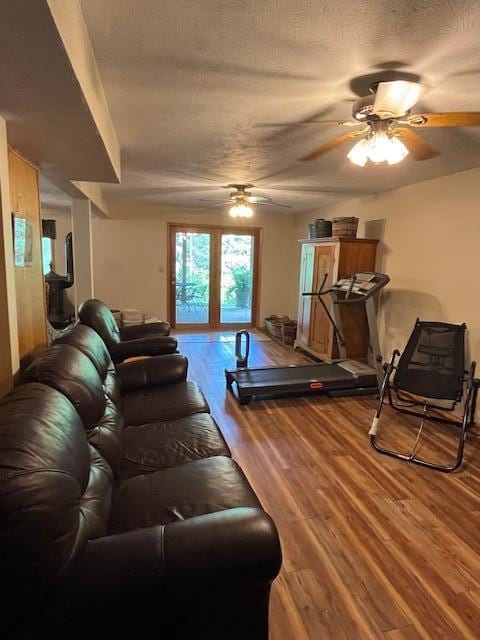 249 Mount Vernon Rd, Forsyth, MO 65653 - living room featuring a ceiling fan, a textured ceiling, and wood finished floors
