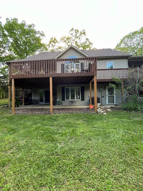 249 Mount Vernon Rd, Forsyth, MO 65653 - rear view of property with a yard, cooling unit, and a wooden deck