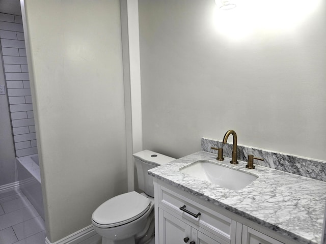 full bathroom with toilet, baseboards, tile patterned flooring, and vanity