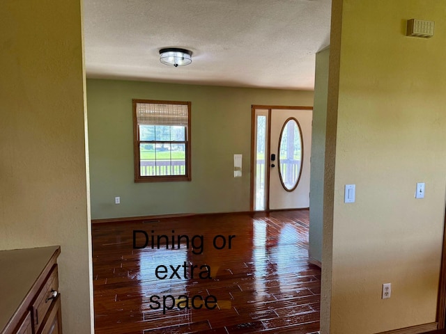 foyer with wood finished floors