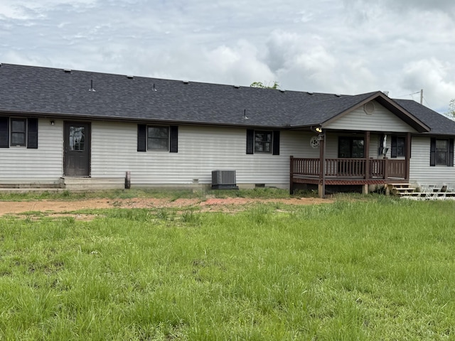 back of house with roof with shingles, entry steps, central AC, and crawl space