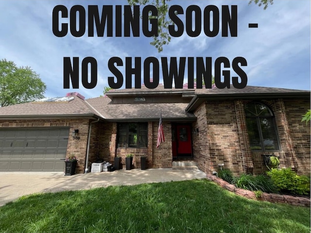 exterior space featuring roof with shingles, an attached garage, brick siding, concrete driveway, and a front lawn