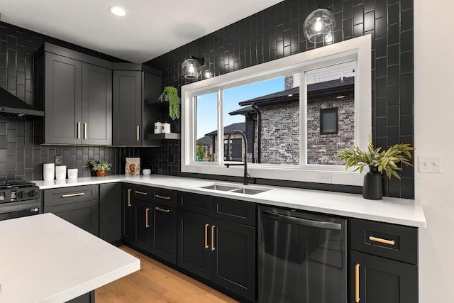 1822 E Cobblestone Dr, Ozark, MO 65721 - kitchen featuring stainless steel dishwasher, a sink, light countertops, tasteful backsplash, and recessed lighting