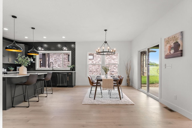 1822 E Cobblestone Dr, Ozark, MO 65721 - dining room with light wood-type flooring, a chandelier, baseboards, and recessed lighting