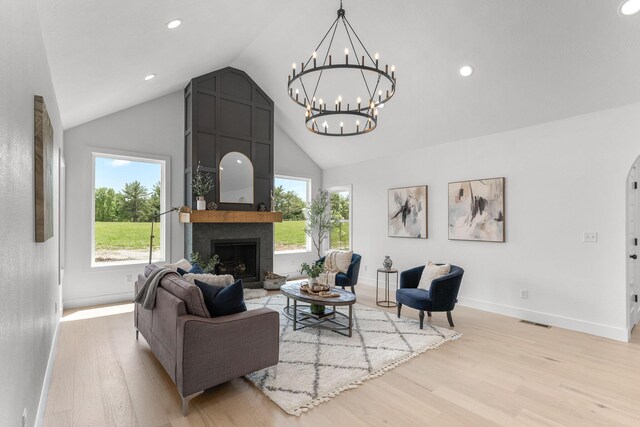 1822 E Cobblestone Dr, Ozark, MO 65721 - living room with light wood finished floors, a fireplace, a chandelier, healthy amount of natural light, and recessed lighting