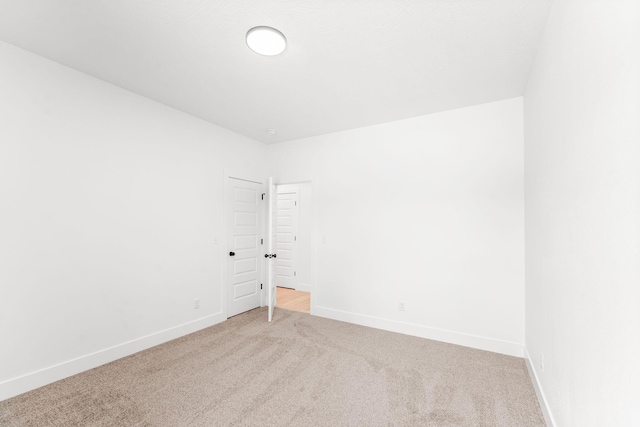 1822 E Cobblestone Dr, Ozark, MO 65721 - unfurnished room featuring carpet flooring and baseboards