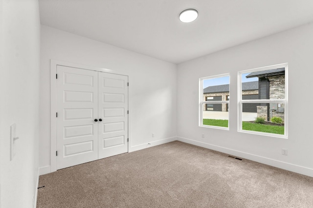 1822 E Cobblestone Dr, Ozark, MO 65721 - unfurnished bedroom with carpet, baseboards, and a closet