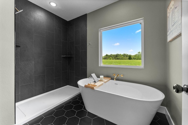 1822 E Cobblestone Dr, Ozark, MO 65721 - bathroom with tile patterned flooring, a freestanding bath, and a tile shower