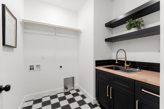 1822 E Cobblestone Dr, Ozark, MO 65721 - laundry area with cabinet space, dark flooring, hookup for an electric dryer, hookup for a washing machine, and baseboards