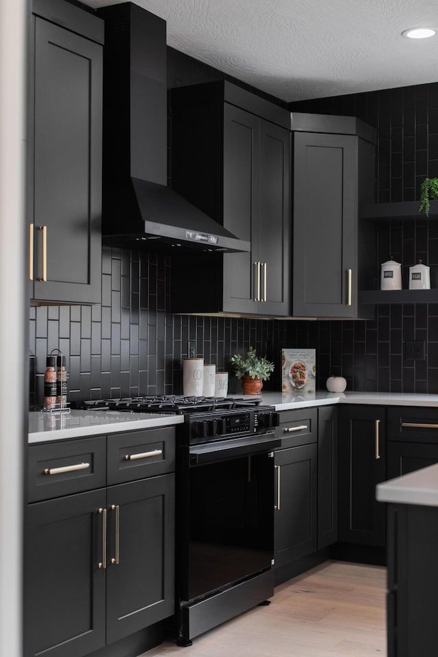 1822 E Cobblestone Dr, Ozark, MO 65721 - kitchen featuring wall chimney exhaust hood, black range with gas stovetop, open shelves, light countertops, and backsplash