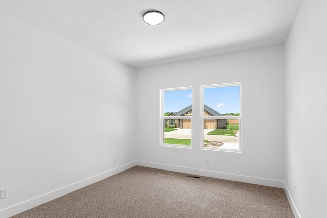 1822 E Cobblestone Dr, Ozark, MO 65721 - carpeted empty room featuring baseboards