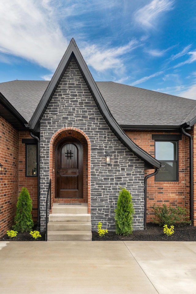 1822 E Cobblestone Dr, Ozark, MO 65721 - property entrance featuring brick siding and a shingled roof