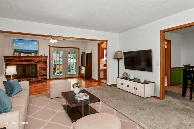 3958 W Bogard St, Springfield, MO 65802 - living area with baseboards, a brick fireplace, ceiling fan, and wood finished floors