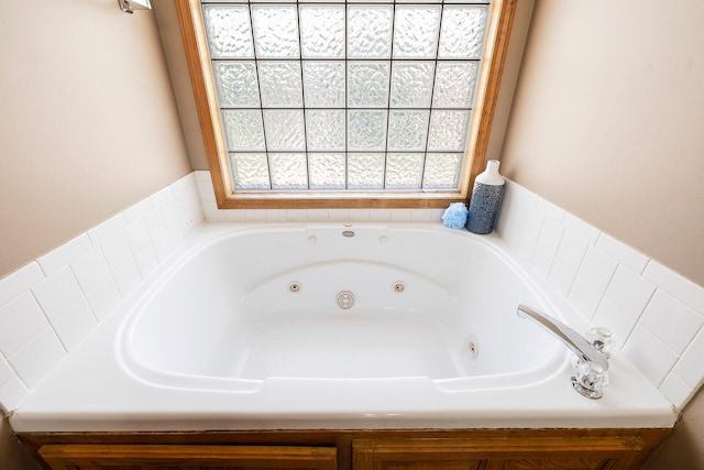full bath with a whirlpool tub
