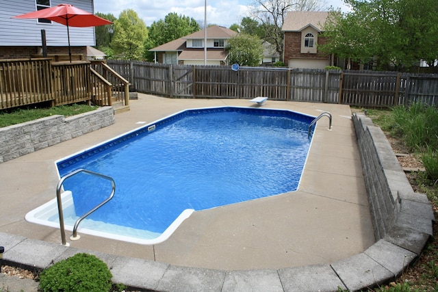 view of pool with a fenced in pool, a fenced backyard, and a deck