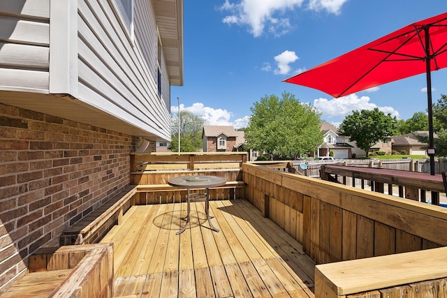 wooden deck featuring a residential view