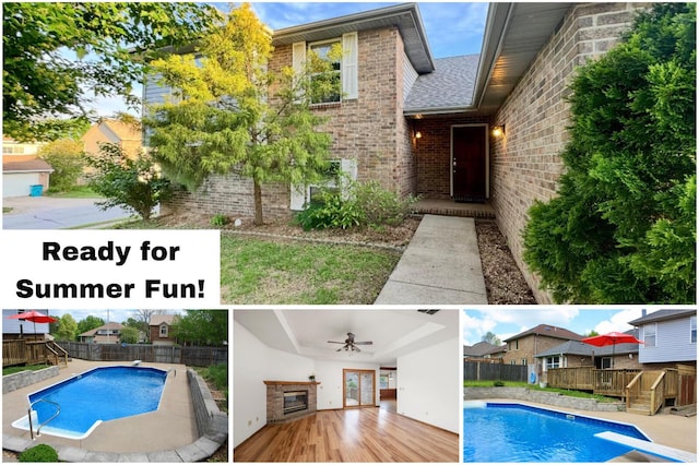 view of pool with fence, a fenced in pool, a diving board, and a deck