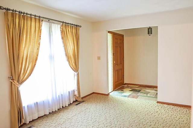 706 W Katella Ct, Springfield, MO 65807 - spare room with baseboards and visible vents