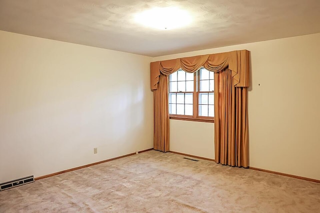 706 W Katella Ct, Springfield, MO 65807 - unfurnished room with visible vents, baseboards, and light colored carpet