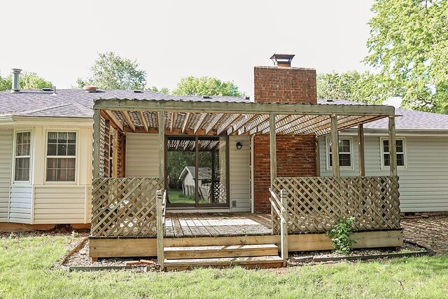 706 W Katella Ct, Springfield, MO 65807 - back of house with a chimney and a wooden deck