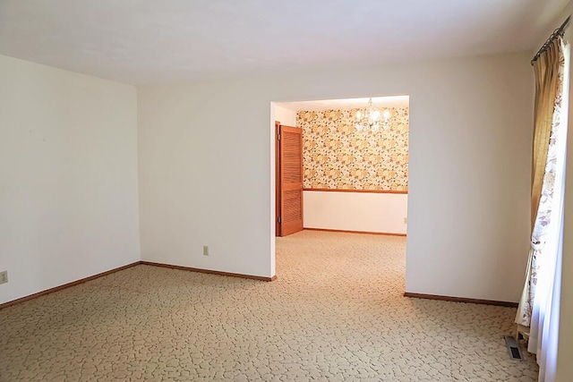 706 W Katella Ct, Springfield, MO 65807 - empty room featuring baseboards and a chandelier