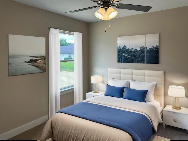 bedroom featuring baseboards and a ceiling fan