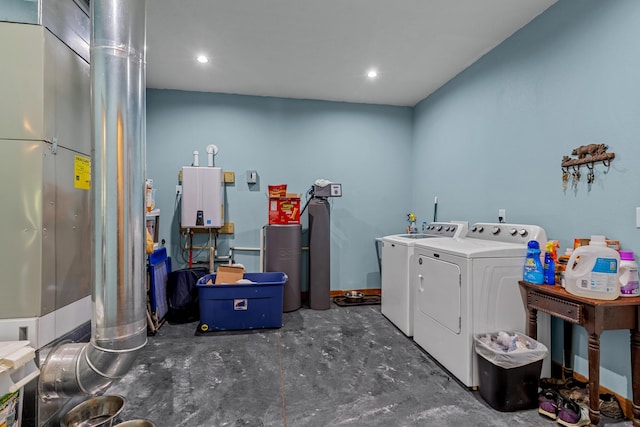 laundry room featuring separate washer and dryer, laundry area, and recessed lighting