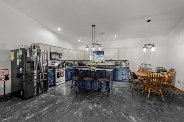 kitchen featuring a kitchen breakfast bar, a center island, stainless steel appliances, decorative light fixtures, and blue cabinetry