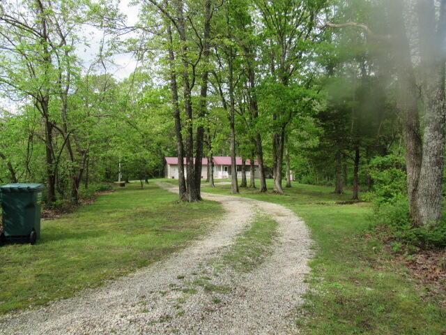 7210 Newkirk Rd, Mountain Grove, MO 65711 - view of road featuring a view of trees and driveway