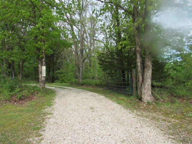 7210 Newkirk Rd, Mountain Grove, MO 65711 - view of road featuring a wooded view