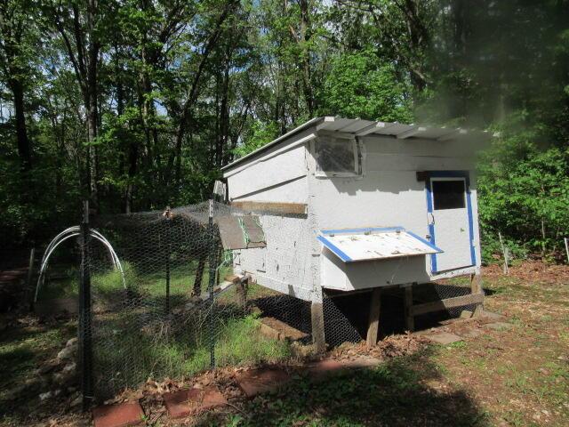 7210 Newkirk Rd, Mountain Grove, MO 65711 - view of side of home featuring exterior structure and an outbuilding
