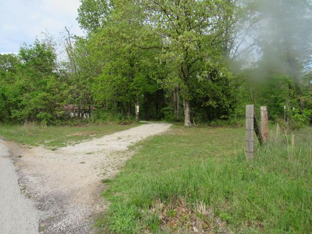 7210 Newkirk Rd, Mountain Grove, MO 65711 - view of road featuring a view of trees