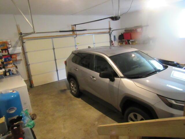 7210 Newkirk Rd, Mountain Grove, MO 65711 - garage with a garage door opener