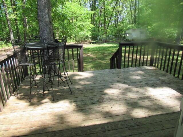 7210 Newkirk Rd, Mountain Grove, MO 65711 - wooden deck featuring outdoor dining space