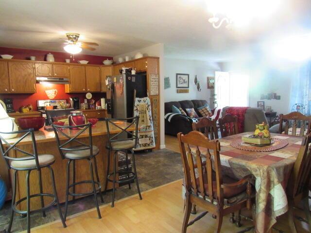 7210 Newkirk Rd, Mountain Grove, MO 65711 - dining space with a ceiling fan and light wood-style floors