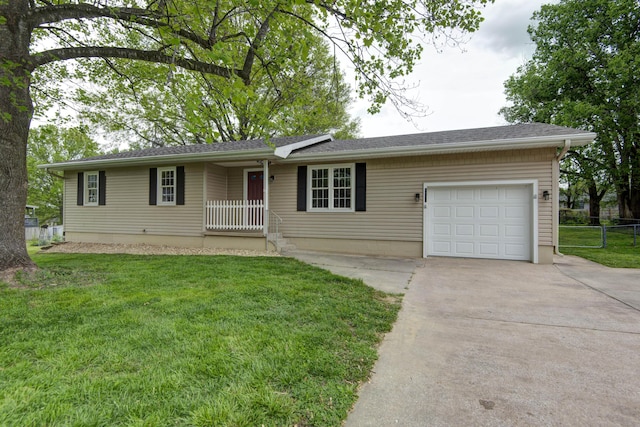 single story home with a garage, fence, driveway, and a front yard