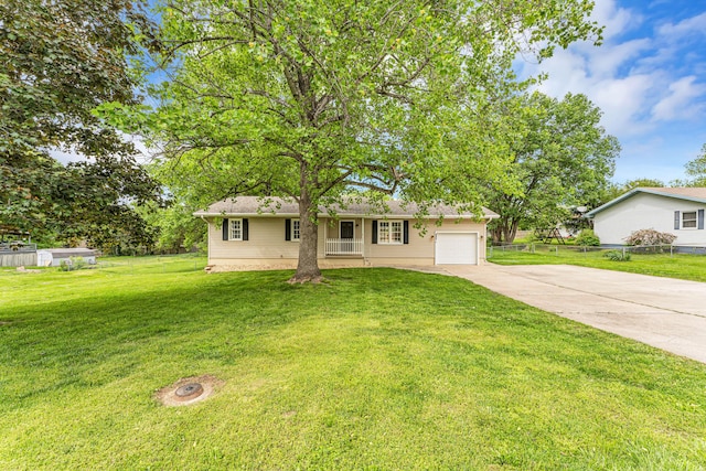 1107 E Mccracken Rd, Ozark, MO 65721 - ranch-style house with concrete driveway, an attached garage, a front lawn, and fence