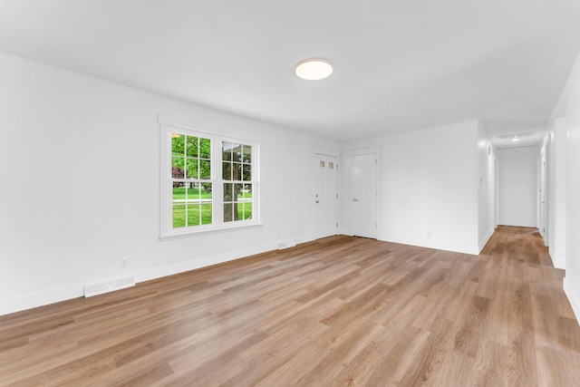 1107 E Mccracken Rd, Ozark, MO 65721 - empty room featuring baseboards, visible vents, and light wood-style floors