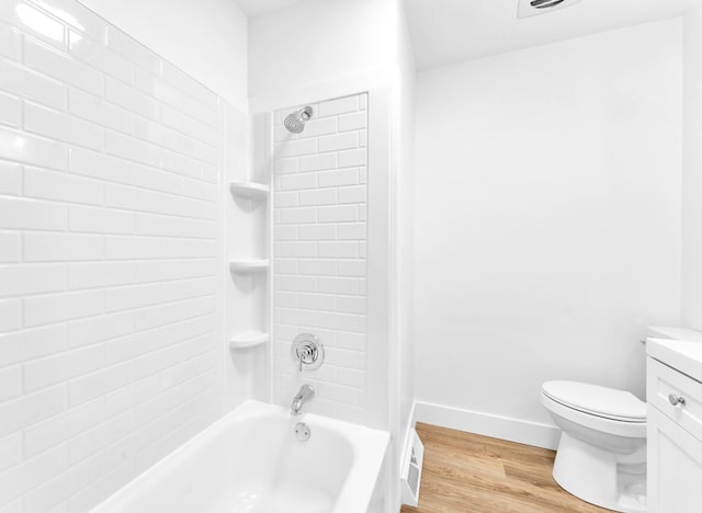 1107 E Mccracken Rd, Ozark, MO 65721 - bathroom featuring vanity, tub / shower combination, toilet, and wood finished floors